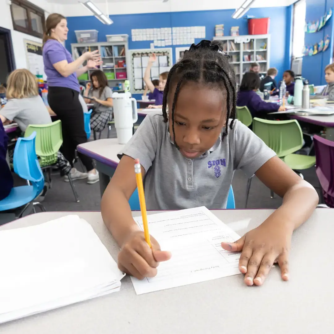 Elementary student concentrating on homework