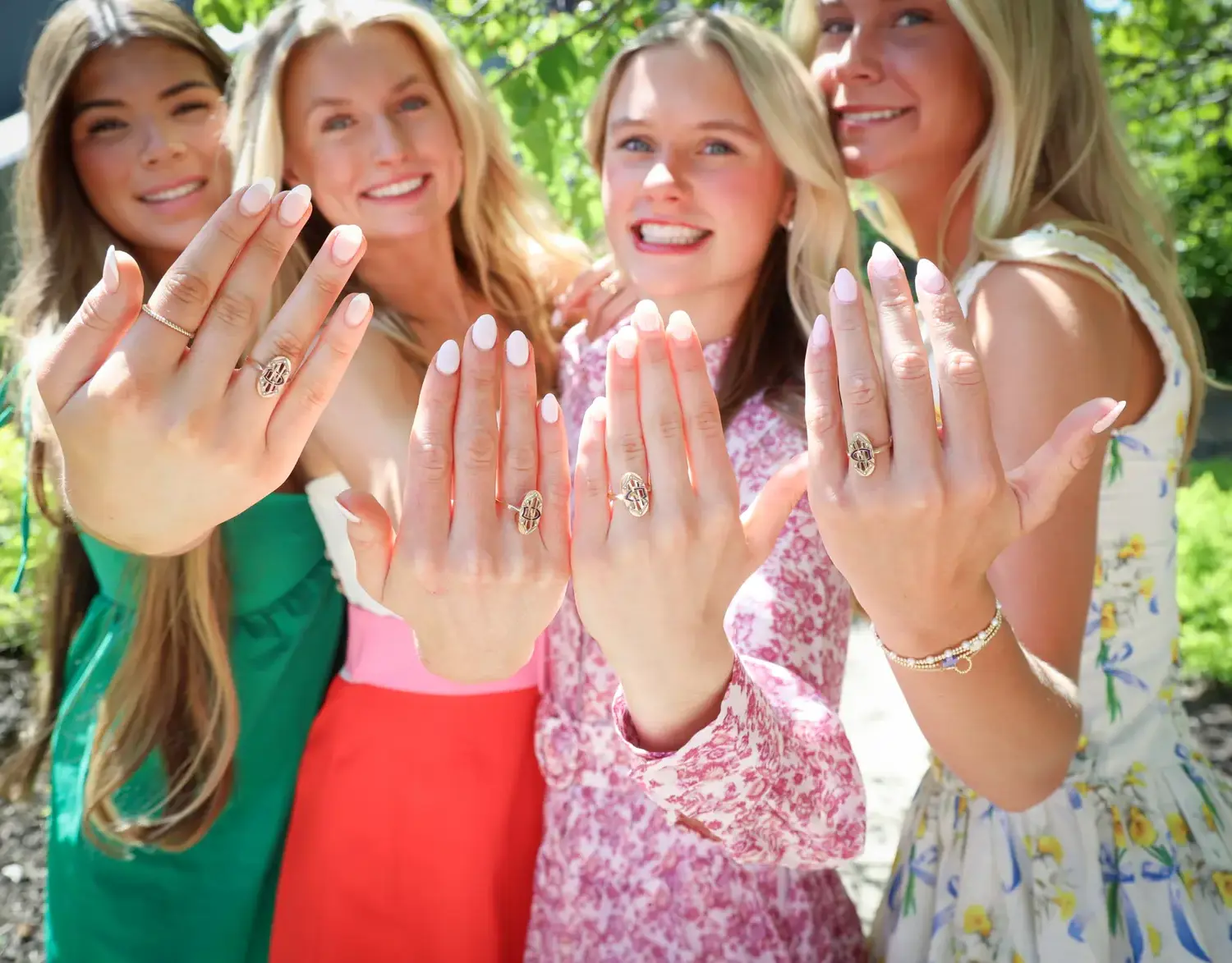 Notre Dame de Sion High School alumni displaying their rings at Ring Ceremony.