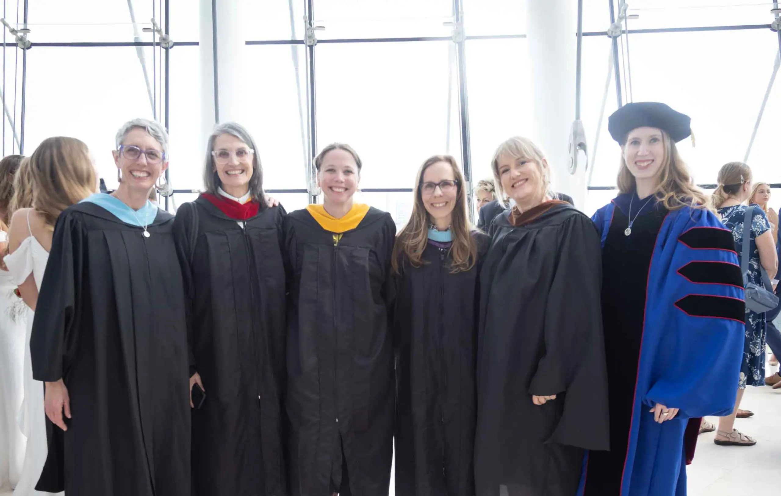 Notre Dame de Sion teachers in robes at High School graduation.