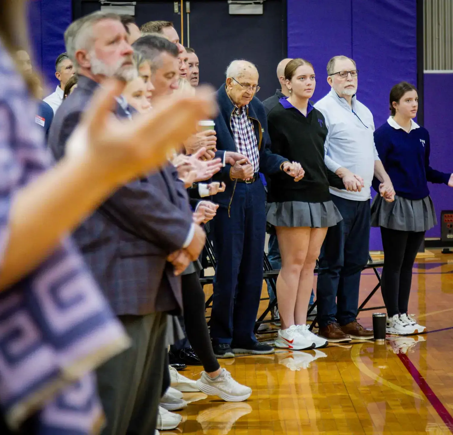 Notre Dame de Sion Intergenerational Mass attendees applauding.