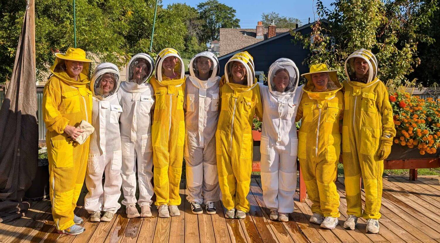 Notre Dame de Sion High School students in Beekeeping kit.