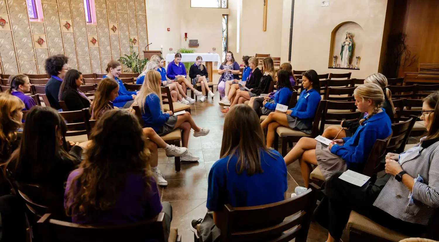 Notre Dame de Sion High School students praying in chapel.