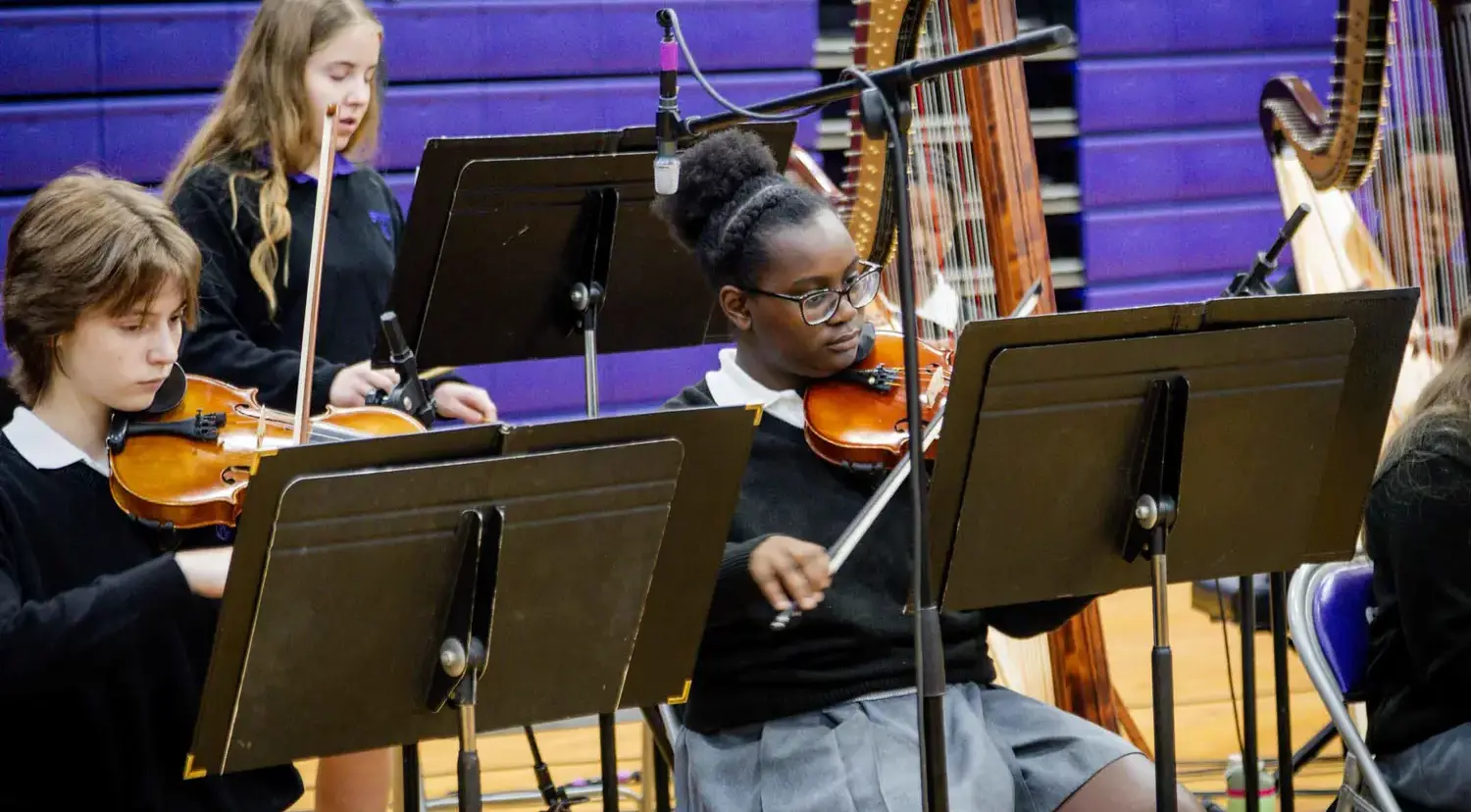 Notre Dame de Sion High School students playing in an ensemble.