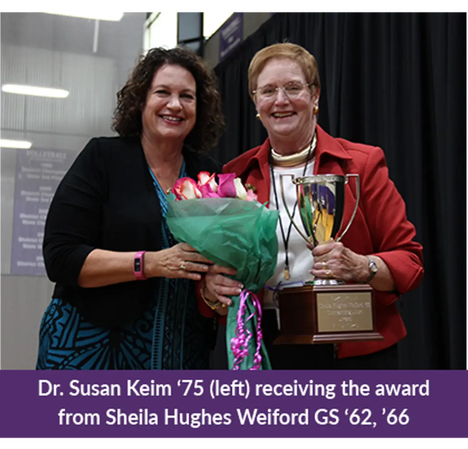 Dr. Susan Keim '75 receiving the Outstanding Alumnae of the Year Award from Sheila Hughes Weiford GS ’62, ’66.